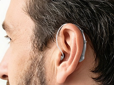 The hearing aid worn behind the ear